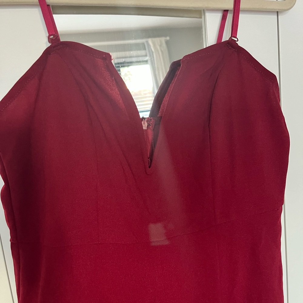 Wine color strapless (or you can put straps on) with deep plunge